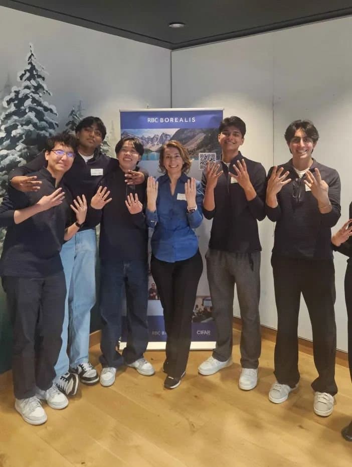 A group photo at RBC Borealis following the project presentation.